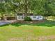 Charming home with well-maintained lawn and mature trees, offering a peaceful curb appeal at 30 N Cleveland Church Rd, Mcdonough, GA 30253