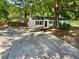 Charming home featuring a carport and a spacious driveway leading to the entrance at 30 N Cleveland Church Rd, Mcdonough, GA 30253