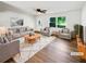 Bright and airy living room features modern furnishings, hardwood floors, and large windows at 30 N Cleveland Church Rd, Mcdonough, GA 30253