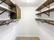 Walk-in closet with ample shelving and hanging rods for organized storage at 30 N Cleveland Church Rd, Mcdonough, GA 30253