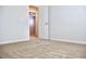 Bedroom featuring neutral carpet and walls, creating a cozy and inviting atmosphere at 631 Egrets Lot 50 Lndg, Covington, GA 30014