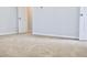 Bedroom features neutral walls and carpet, creating a serene space with multiple doorways at 631 Egrets Lot 50 Lndg, Covington, GA 30014