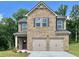 Charming two-story brick home with a two-car garage and well-maintained landscaping at 631 Egrets Lot 50 Lndg, Covington, GA 30014