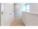 Well-lit hallway featuring fresh paint and carpeted floor at 631 Egrets Lot 50 Lndg, Covington, GA 30014