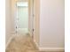 Hallway with carpet flooring and neutral walls, connecting various rooms in the home at 631 Egrets Lot 50 Lndg, Covington, GA 30014