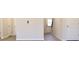Hallway with ample doorways and hard surface floors and views of entryway at 631 Egrets Lot 50 Lndg, Covington, GA 30014