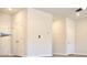 Hallway with closet doors and neutral paint, offering ample storage and a clean aesthetic at 631 Egrets Lot 50 Lndg, Covington, GA 30014