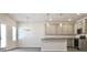 Bright kitchen featuring modern pendant lighting, stainless steel appliances, and gray cabinets at 631 Egrets Lot 50 Lndg, Covington, GA 30014