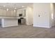 Spacious open-concept kitchen with granite countertops and stainless steel appliances at 631 Egrets Lot 50 Lndg, Covington, GA 30014