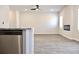 Open-concept living room boasts wood floors, a modern fireplace, and plenty of natural light at 631 Egrets Lot 50 Lndg, Covington, GA 30014