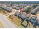 Aerial view of suburban homes with lawns, fenced backyard, and roadway access at 3372 Baylor Cir, Mcdonough, GA 30253