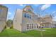 Nice backyard featuring a grill, green grass, patio and modern exterior at 3372 Baylor Cir, Mcdonough, GA 30253