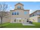 Spacious backyard with lush grass, a patio, and a modern two-story home at 3372 Baylor Cir, Mcdonough, GA 30253