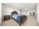 Bedroom with neutral carpeting, a TV, and a dark wood bed and nightstand at 3372 Baylor Cir, Mcdonough, GA 30253
