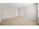 Neutral bedroom featuring plush carpeting, light walls, and two white doors at 3372 Baylor Cir, Mcdonough, GA 30253