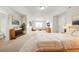 Bright bedroom showcasing bed, neutral walls, modern furniture, and ample natural light at 3372 Baylor Cir, Mcdonough, GA 30253