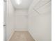 Walk-in closet featuring carpet, white walls and shelving for optimal organization and storage at 3372 Baylor Cir, Mcdonough, GA 30253