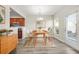Bright dining area with a modern table, stylish chairs, and views to the kitchen at 3372 Baylor Cir, Mcdonough, GA 30253
