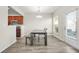 Cozy dining area with a dark wood table, direct access to an outdoor space at 3372 Baylor Cir, Mcdonough, GA 30253
