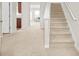 Welcoming entryway showcasing the staircase, hardwood floors, and seamless transition at 3372 Baylor Cir, Mcdonough, GA 30253