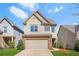 Charming two-story home with a two-car garage, lawn and landscaped front yard at 3372 Baylor Cir, Mcdonough, GA 30253