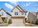 Charming two-story home with a two-car garage, lawn and landscaped front yard at 3372 Baylor Cir, Mcdonough, GA 30253