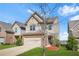 Charming two-story home with a two-car garage, lawn and landscaped front yard at 3372 Baylor Cir, Mcdonough, GA 30253