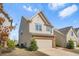 Charming two-story home with a two-car garage, lawn and landscaped front yard at 3372 Baylor Cir, Mcdonough, GA 30253