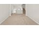 Hallway with neutral walls and carpet with stairs to upper floor at 3372 Baylor Cir, Mcdonough, GA 30253