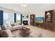 Cozy living room featuring a fireplace, bookshelves, and comfortable seating at 3372 Baylor Cir, Mcdonough, GA 30253