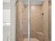 Glass enclosed tiled shower with a built in seat and shower head with stream options at 3372 Baylor Cir, Mcdonough, GA 30253
