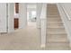 View of staircase with carpeted steps leading to the upper level of the home at 3372 Baylor Cir, Mcdonough, GA 30253