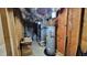 Unfinished basement area with exposed beams and a water heater system at 2961 Rolling Ln, Winston, GA 30187