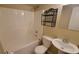 Bathroom featuring a shower/tub combo, pedestal sink, and decorative shelving at 2961 Rolling Ln, Winston, GA 30187