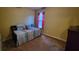 Cozy bedroom featuring plush carpeting, neutral paint and patterned bedding at 2961 Rolling Ln, Winston, GA 30187