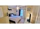 Cozy bedroom featuring a ceiling fan with crystal embellishments and neutral-toned walls at 2961 Rolling Ln, Winston, GA 30187
