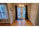 Dining area with stylish light fixture, French doors and neutral paint at 2961 Rolling Ln, Winston, GA 30187