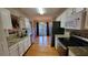 Modern kitchen with granite countertops, stainless steel appliances, and hardwood floors at 2961 Rolling Ln, Winston, GA 30187