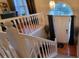 View from the top of the staircase to the front door and hardwood floors in the foyer at 2961 Rolling Ln, Winston, GA 30187
