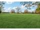 Large lot with a home and mature trees in the background at 3825 Green Ave, Loganville, GA 30052