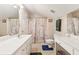 Clean bathroom boasts double vanity, shower/tub combo, and updated fixtures at 3825 Green Ave, Loganville, GA 30052