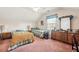Spacious bedroom with two twin beds, ample closet space, and plenty of natural light at 3825 Green Ave, Loganville, GA 30052