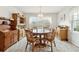 Bright dining room featuring hardwood floors and large windows at 3825 Green Ave, Loganville, GA 30052