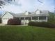 Charming one-story home with a welcoming front porch and well-manicured landscaping at 3825 Green Ave, Loganville, GA 30052