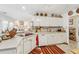 Kitchen features white cabinets, double sink, and a corner pantry at 3825 Green Ave, Loganville, GA 30052