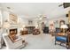 Bright living room with fireplace, comfy seating, and hardwood floors at 3825 Green Ave, Loganville, GA 30052