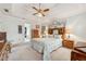 Main bedroom with a king-size bed and large windows at 3825 Green Ave, Loganville, GA 30052