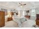 Large main bedroom with ceiling fan and en-suite bathroom at 3825 Green Ave, Loganville, GA 30052