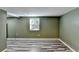 Basement space with wood-look floors and a small window at 3479 Chestnut Dr, Atlanta, GA 30340
