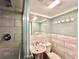 This bathroom features a shower with glass doors, a modern sink, and updated tile throughout the space at 3479 Chestnut Dr, Atlanta, GA 30340